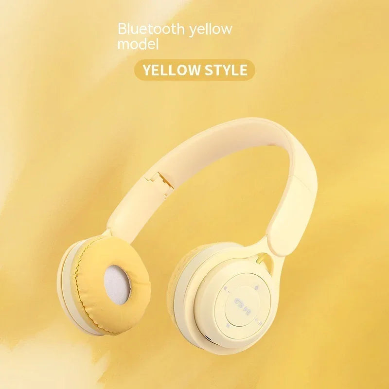 Yellow Bluetooth wireless headphones with padded ear cushions on a yellow background