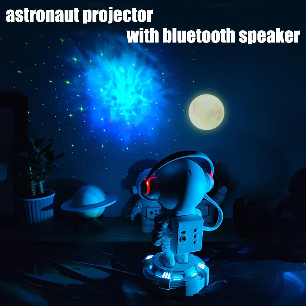 Astronaut projector with Bluetooth speaker displaying blue starry sky and moon in dark room