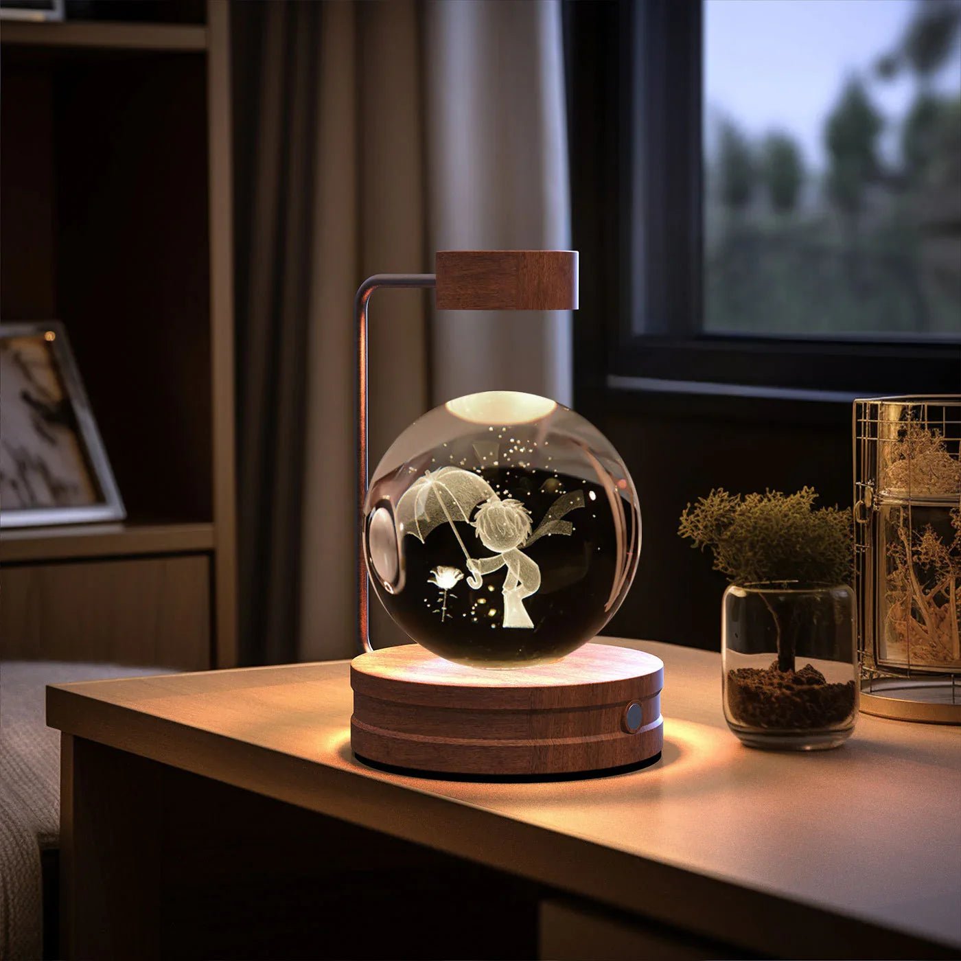 Wooden base LED lamp with floating glass globe etched with boy holding umbrella and flower