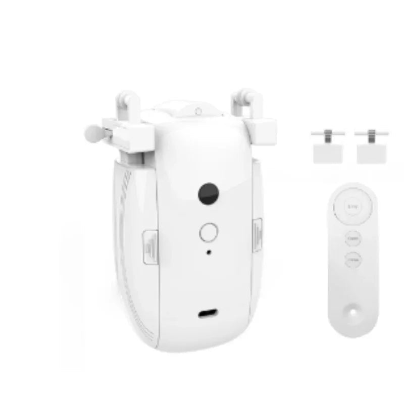 White compact drone with camera, foldable arms, remote control, and two small accessories