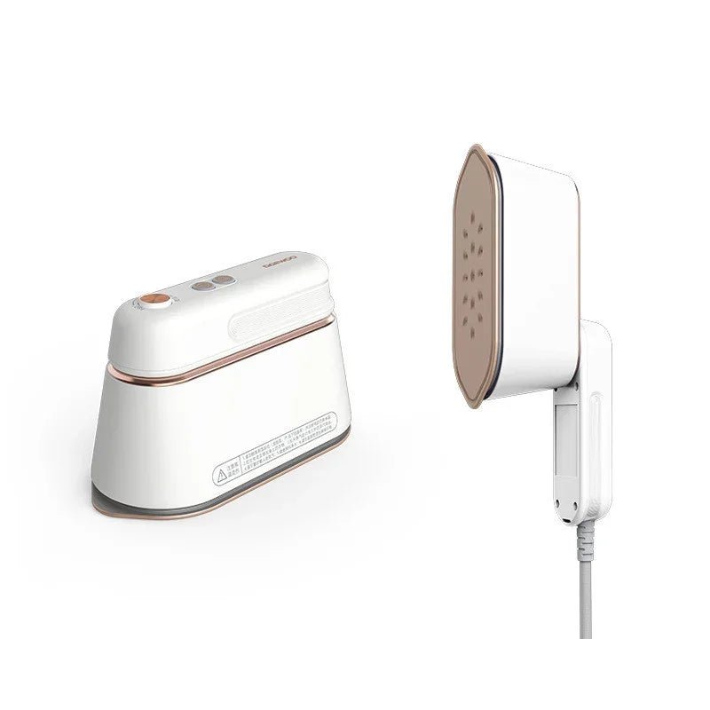 Modern white handheld garment steamer with rose gold accents and power cord