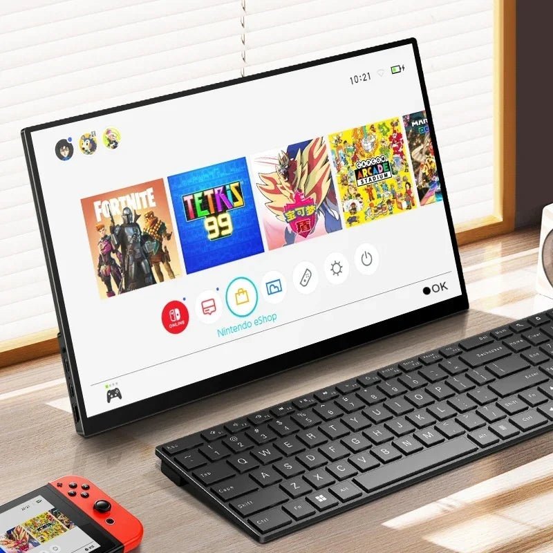 Nintendo Switch docked beside black wireless keyboard and red Joy-Con, displaying Fortnite and Tetris 99 on screen
