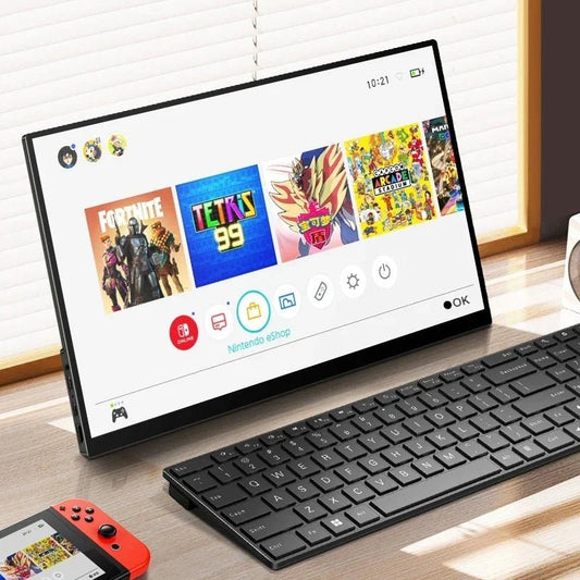 Nintendo Switch docked beside black wireless keyboard and red Joy-Con, displaying Fortnite and Tetris 99 on screen